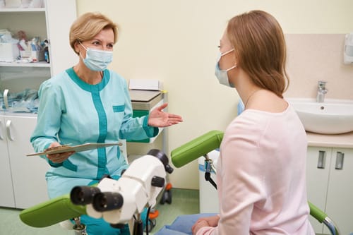 Doctor supporting a patient after an ectopic pregnancy