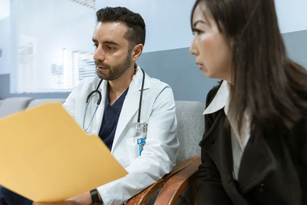 CBD & THC Oil for Dementia Agitation: What Research Says 5 Doctor discussing treatment options with patient and family member