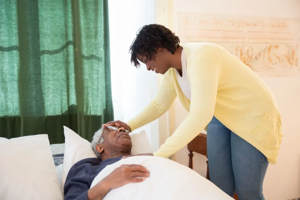CBD & THC Oil for Dementia Agitation: What Research Says 25 Caregiver gently holding hand of elderly dementia patient in calm room