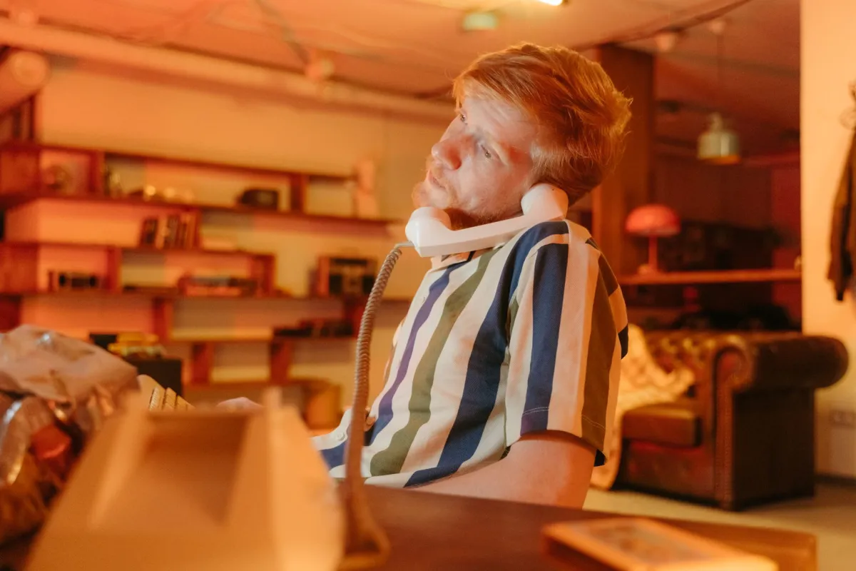 Desk Posture and Back Pain From Sitting All Day: What Works 1 Person slouching at office desk experiencing back pain from poor sitting posture