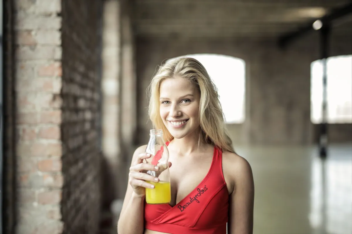 Woman smiling outdoors reflecting improved mood after GLP-1 weight loss treatment