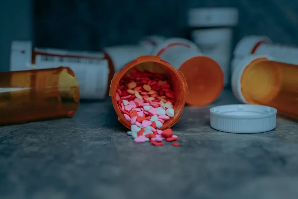 Person holding prescription bottle next to dollar bills, GLP-1 drug cost concept