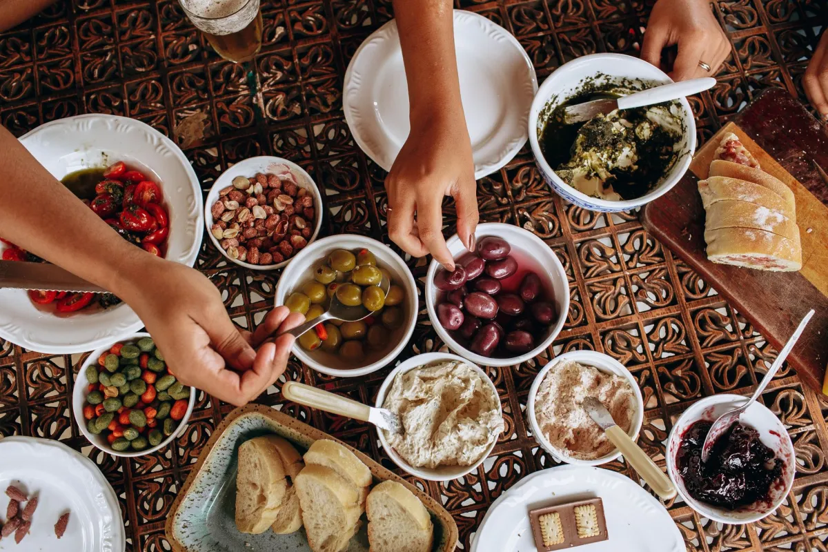 Colorful Mediterranean diet spread with vegetables, olive oil, fish and whole grains