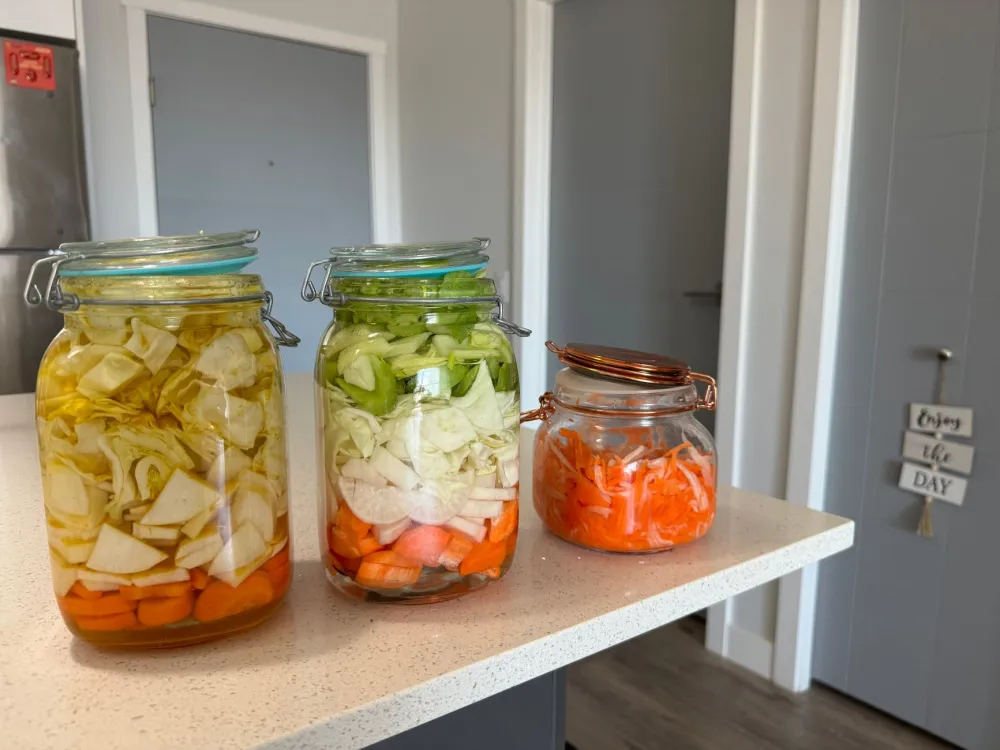 Jars of fermented vegetables and yogurt supporting a healthy gut microbiome