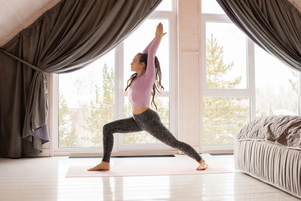 Person doing a gentle morning yoga routine that includes neck and shoulder movements