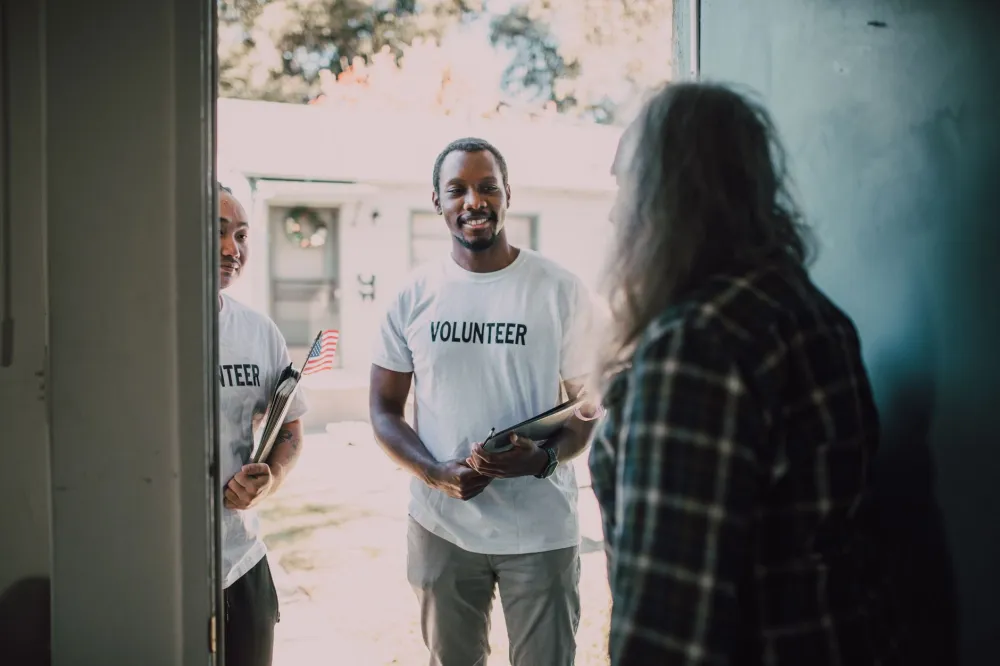 Community health outreach volunteers providing wellness screenings at a local event