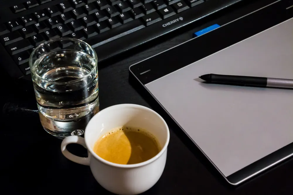 Glass of water on a desk as a simple remedy for afternoon fatigue and energy dips