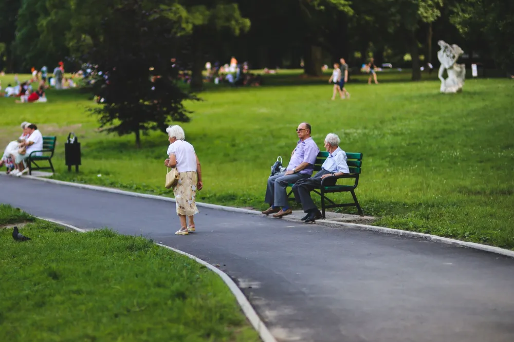Active older adult walking outdoors to maintain muscle mass during weight loss