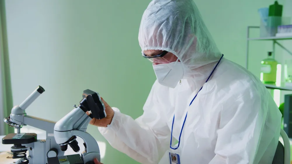 Researcher examining longevity data from a GLP-1 mouse lifespan study