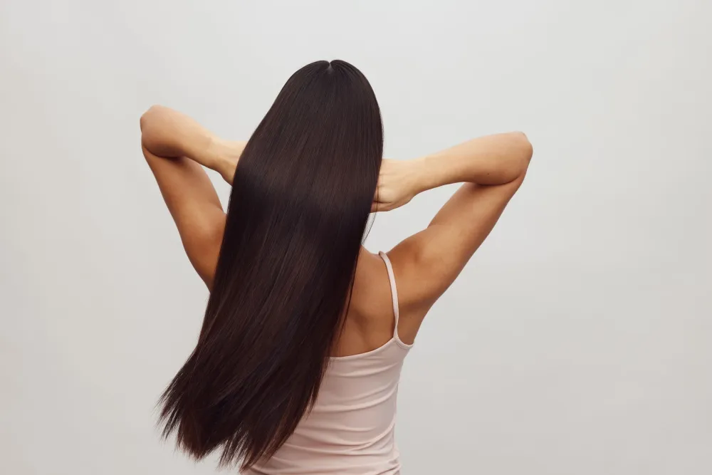 Hair Thinning: What It Is and What You Can Do Early 5 Woman with healthy thick hair after early hair thinning treatment routine