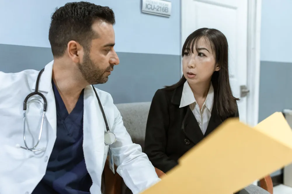 Doctor and patient having an open conversation about treatment costs in clinic