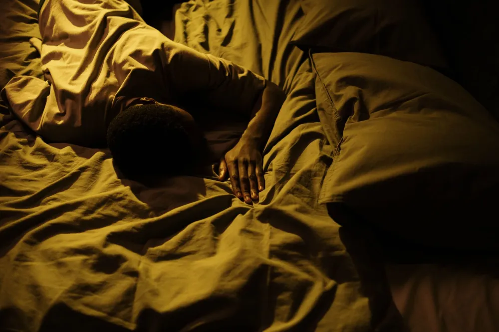 Person sleeping on their side with a supportive pillow keeping the neck aligned