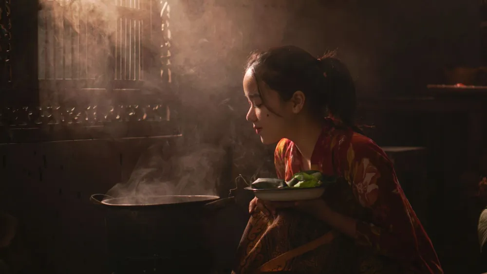 Person leaning over a bowl of steam to relieve sinus congestion at home