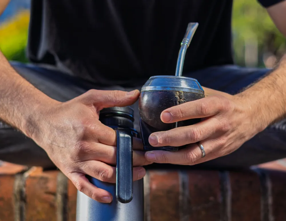 Sleep Hygiene Habits That Transform Your Nights 3 Man holding a warm mug of herbal tea during a calming pre-sleep wind-down routine