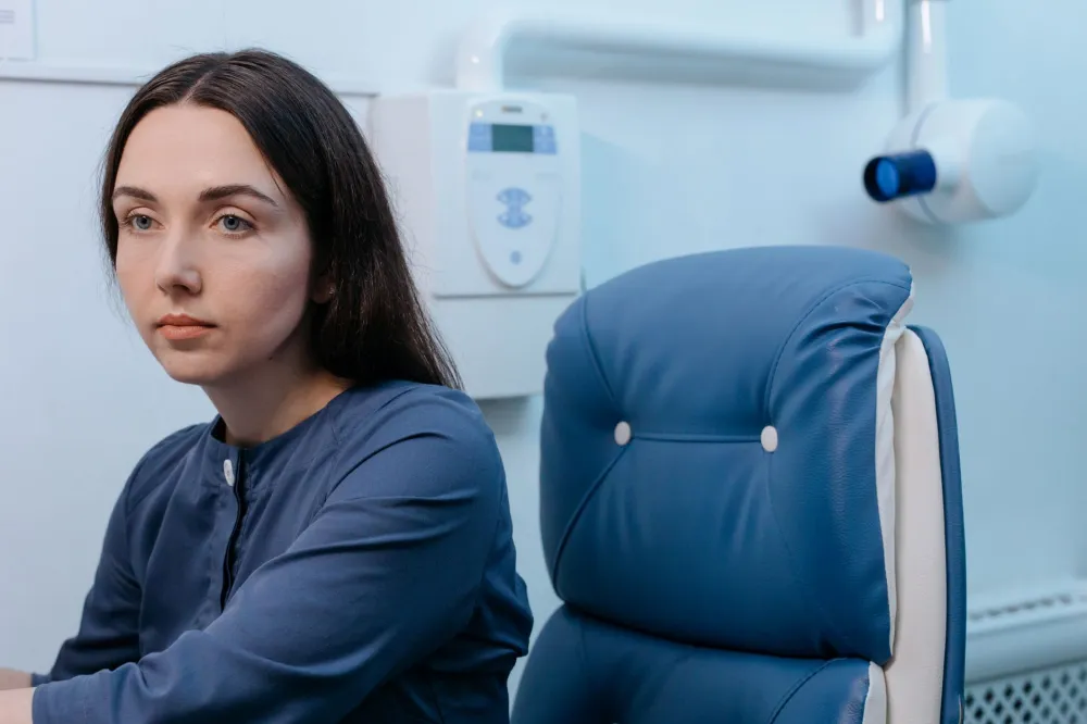 Man waiting calmly in a clinic for a routine skin and sexual health checkup