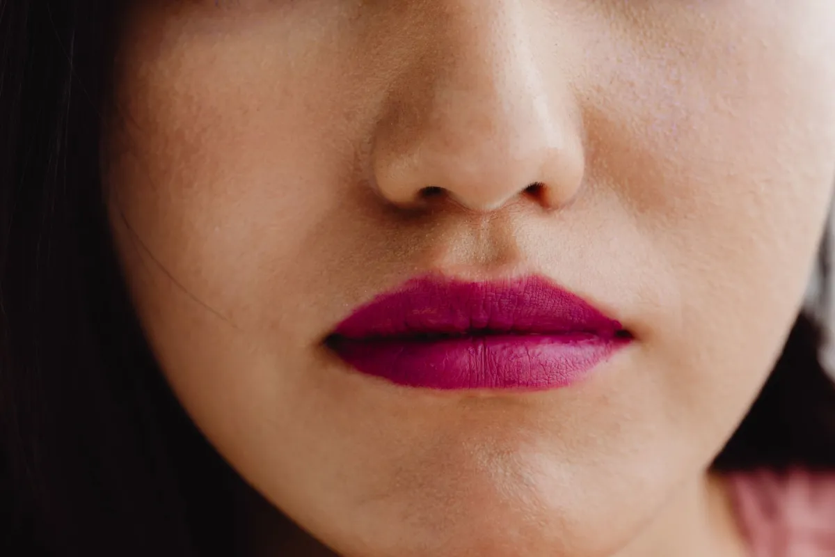 Close-up of lip area showing small skin bumps for Fordyce spots vs pimples comparison