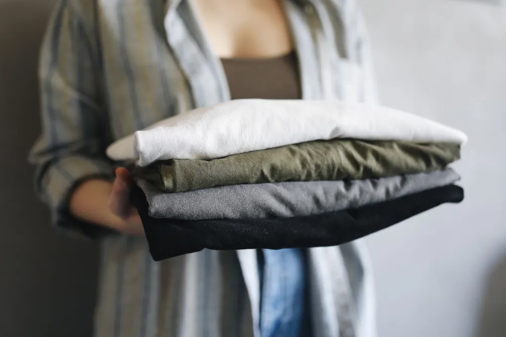 Stack of folded cotton laundry, breathable fabric that helps reduce groin skin irritation