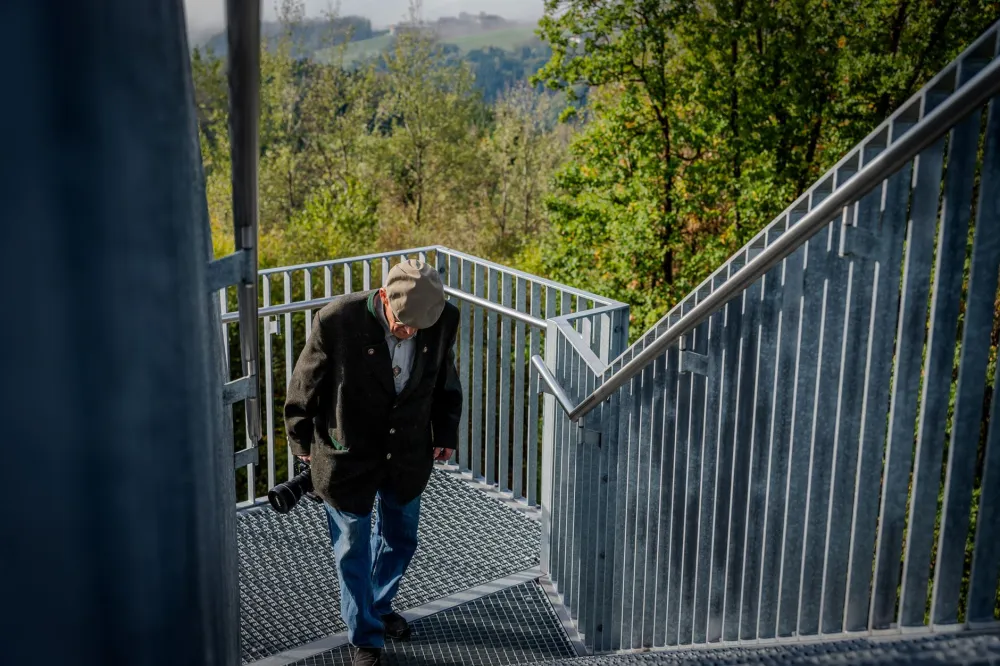 Older woman climbing stairs, showing why GLP-1 and protein matter for muscle strength