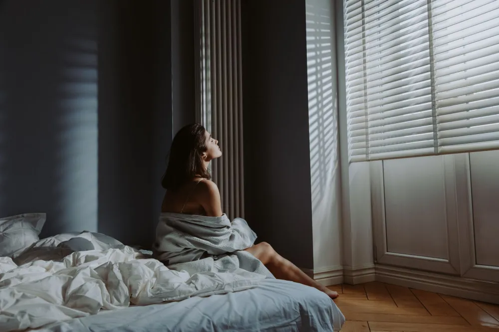 Sunlight streaming through bedroom window helping regulate sleep and brain health