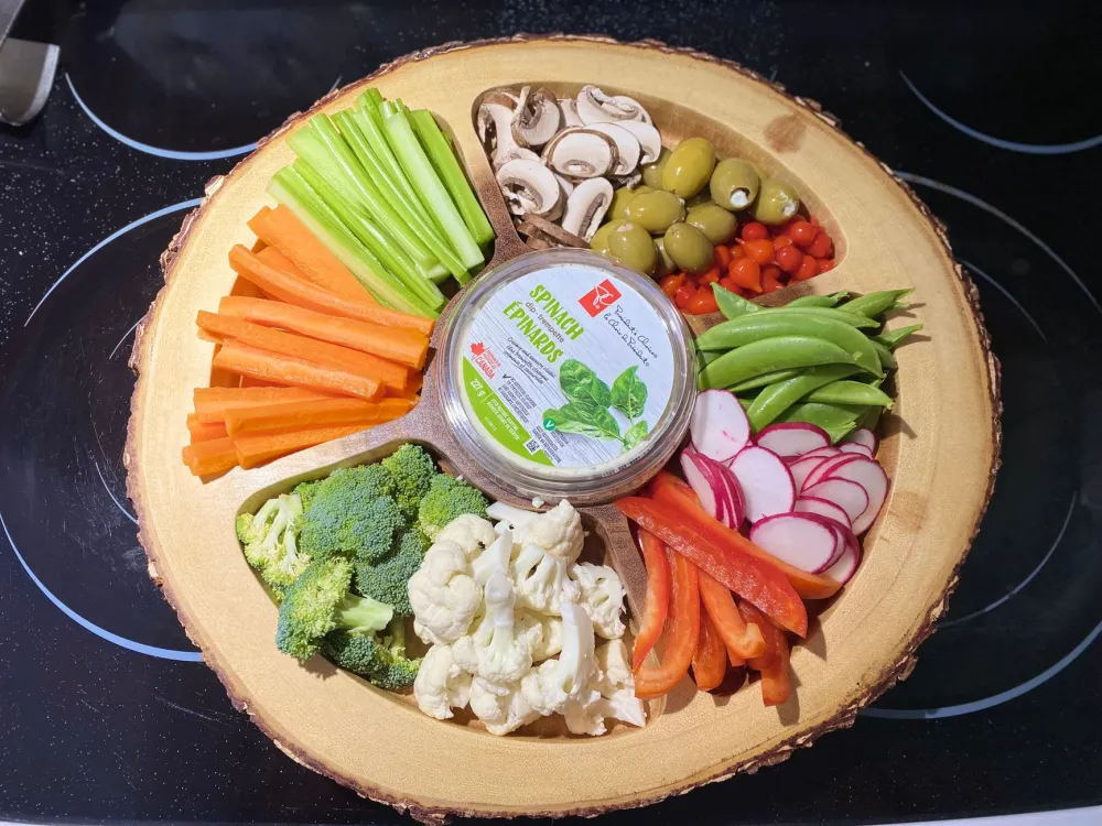Colorful low-carb vegetables ideal for a keto grocery list for beginners on a wooden board