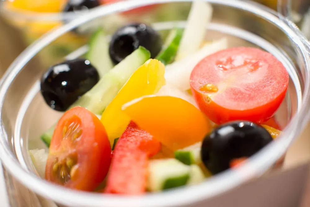 Colorful low-carb vegetable salad bowl with avocado and seeds for ketosis-friendly fiber