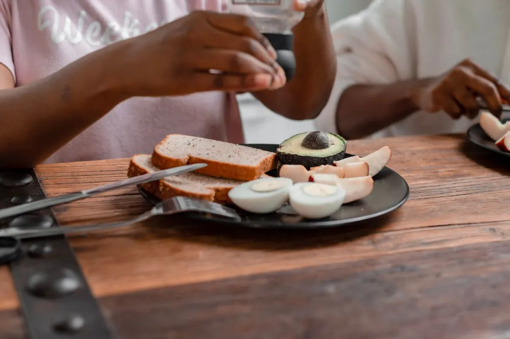 Hard-boiled eggs and avocado halves, simple keto snacks that keep carbs low