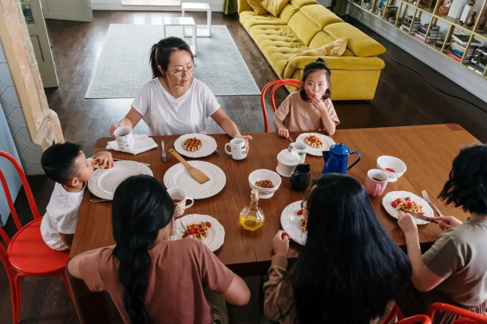 Family sharing a healthy meal together at a dining table