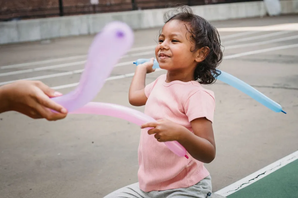 Young child playing outside in a park on a sunny day
