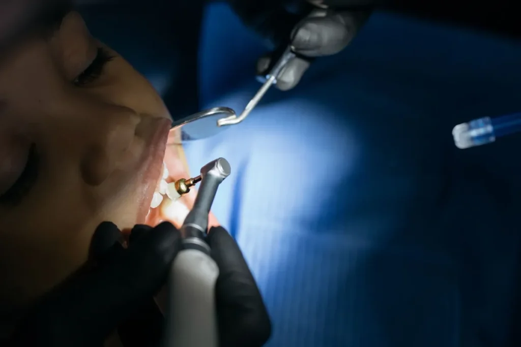 Young child at dental checkup, baby teeth examined by pediatric dentist