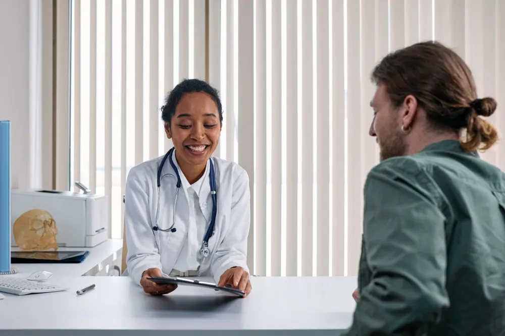 Doctor talking with a patient about prescription options and generic liraglutide savings